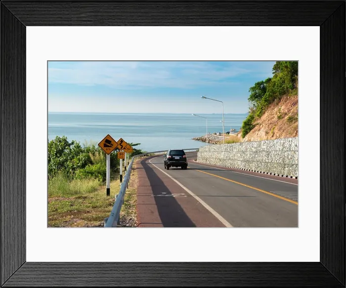 Framed Print : Sea side street near mountain with blue sky in clear day in Chanthaburi, Thailand Framed Print : Sea side street near mountain with blue sky in clear day in Chanthaburi, Thailand