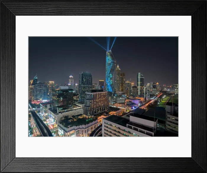 Framed Print : Night view with skyscraper in business district in Bangkok Thailand. Light show at Magnolias Ratchaprasong in Bangkok, Thailand Framed Print : Night view with skyscraper in business district in Bangkok Thailand. Light show at Magnolias Ratchaprasong in Bangkok, Thailand