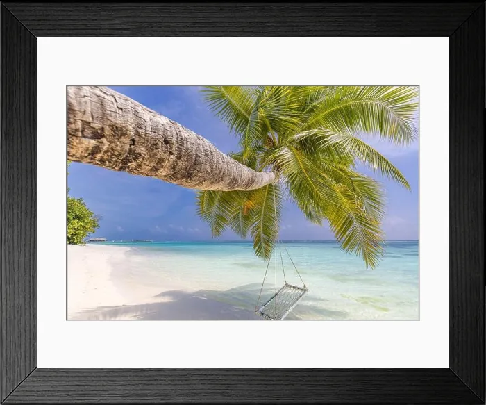 Framed Print : Tropical island beach as summer landscape with beach swing or hammock. Happy idyllic blue sky sand palm tree leaves and calm sea beach. Couple romance Framed Print : Tropical island beach as summer landscape with beach swing or hammock. Happy idyllic blue sky sand palm tree leaves and calm sea beach. Couple romance