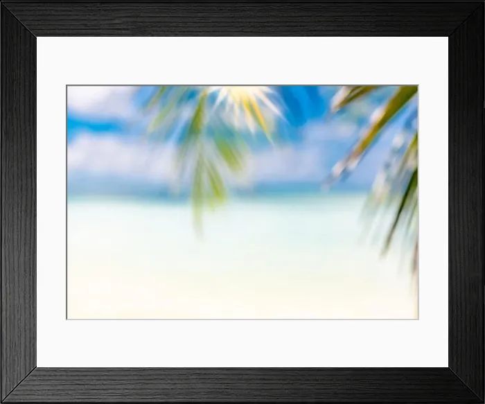 Framed Print : Blurred blue sky and sea with bokeh light and leaves of coconut palm tree. Landscape of tropical summer. Summer vacation concept. Luxury dream travel Framed Print : Blurred blue sky and sea with bokeh light and leaves of coconut palm tree. Landscape of tropical summer. Summer vacation concept. Luxury dream travel