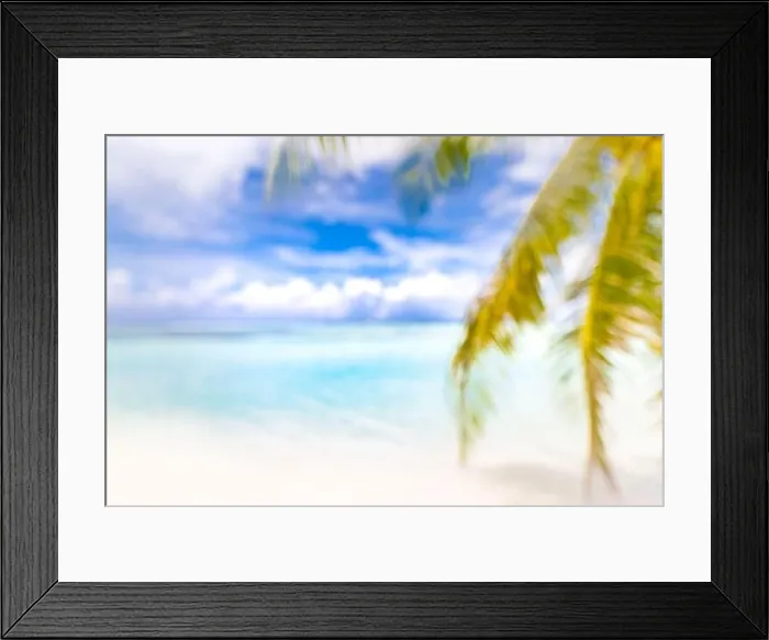 Framed Print : Blurred blue sky and sea with bokeh light and leaves of coconut palm tree. Landscape of tropical summer. Summer vacation concept. Luxury dream travel Framed Print : Blurred blue sky and sea with bokeh light and leaves of coconut palm tree. Landscape of tropical summer. Summer vacation concept. Luxury dream travel