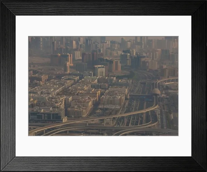 Framed Print : DUBAI, UAE - APRIL 29: Aerial view of Downtown Dubai and skyscrapers during morning sandstorm. Highway and trainline, soft light over the sand Framed Print : DUBAI, UAE - APRIL 29: Aerial view of Downtown Dubai and skyscrapers during morning sandstorm. Highway and trainline, soft light over the sand