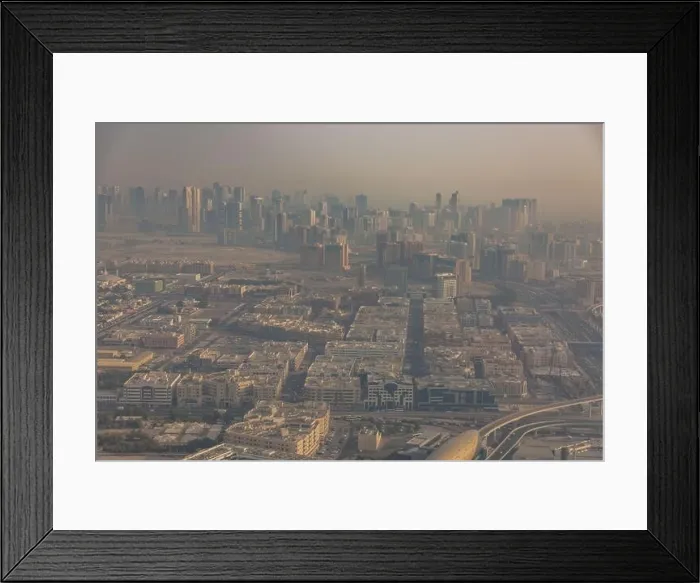 Framed Print : DUBAI, UAE - APRIL 29: Aerial view of Downtown Dubai and skyscrapers during morning sandstorm. Highway and trainline, soft light over the sand Framed Print : DUBAI, UAE - APRIL 29: Aerial view of Downtown Dubai and skyscrapers during morning sandstorm. Highway and trainline, soft light over the sand