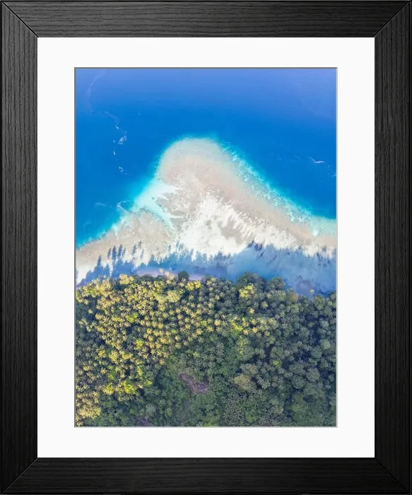 Framed Print : A coral reef surrounds idyllic islands near New Britain in Papua New Guinea. This area is part of the Coral Triangle due to its biodiversity Framed Print : A coral reef surrounds idyllic islands near New Britain in Papua New Guinea. This area is part of the Coral Triangle due to its biodiversity