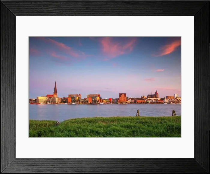 Framed Print : Rostock, Germany. Cityscape image of Rostock riverside with St. Peter's Church during summer sunset