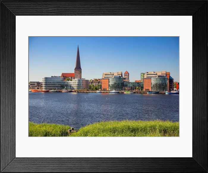 Framed Print : Rostock, Germany. Cityscape image of Rostock riverside with St. Peter's Church during sunny summer day Framed Print : Rostock, Germany. Cityscape image of Rostock riverside with St. Peter's Church during sunny summer day
