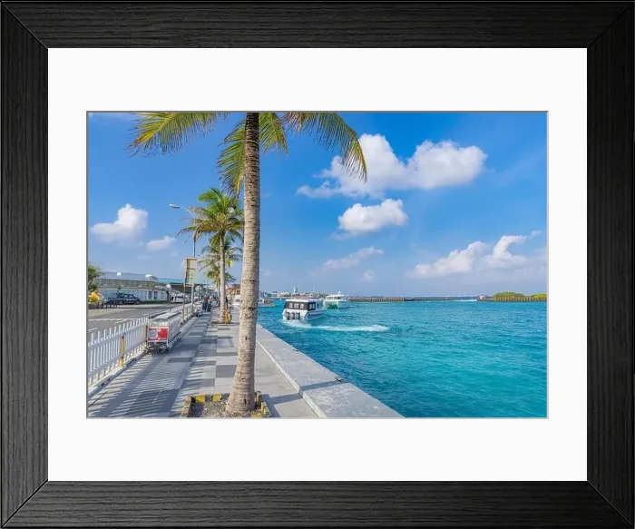Framed Print : Hulhule island, Maldives - 01.19.22: Boats at the harbor next to Ibrahim Nasir International Airport in Male, Maldives. Travelers arriving and depar Framed Print : Hulhule island, Maldives - 01.19.22: Boats at the harbor next to Ibrahim Nasir International Airport in Male, Maldives. Travelers arriving and depar