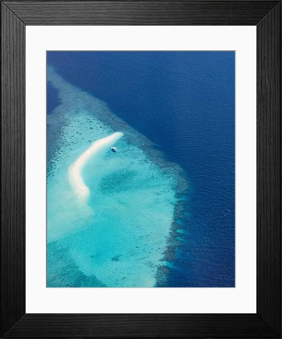 Framed Print : Aerial picture of turquoise blue tropical ocean lagoon, white sandy beach, sandbank coral reef shallow water with boat. Nature perfection in Maldives Framed Print : Aerial picture of turquoise blue tropical ocean lagoon, white sandy beach, sandbank coral reef shallow water with boat. Nature perfection in Maldives