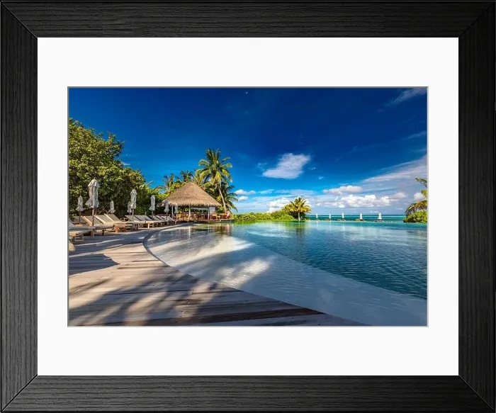 Framed Print : Luxury beach swimming pool at sunset with reflection of palm trees, tropical landscape, exotic island hotel. Loungers and chairs with closed umbrella Framed Print : Luxury beach swimming pool at sunset with reflection of palm trees, tropical landscape, exotic island hotel. Loungers and chairs with closed umbrella