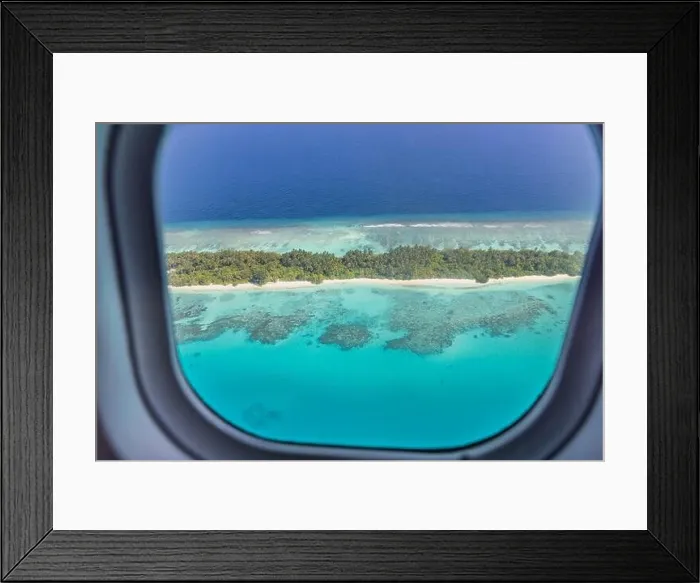 Framed Print : Airplane window with beautiful Maldives island view. Luxury summer holiday travel tourism background, view from airplane window. Atolls islands Framed Print : Airplane window with beautiful Maldives island view. Luxury summer holiday travel tourism background, view from airplane window. Atolls islands