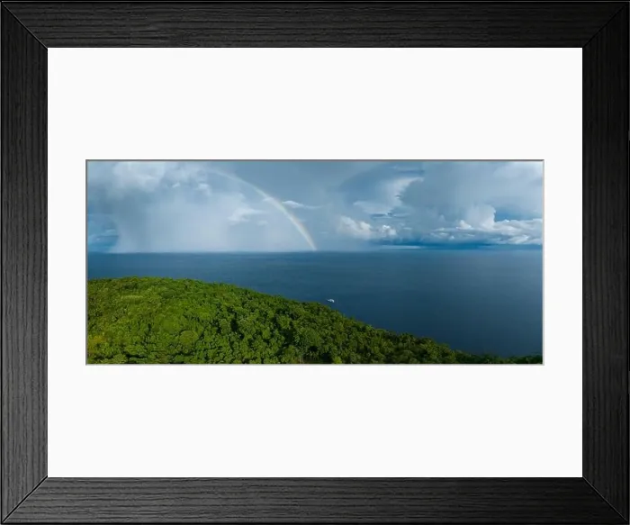 Framed Print : A bright rainbow appears behind a remote tropical island in the Solomon Islands. This beautiful country is home to spectacular marine biodiversity Framed Print : A bright rainbow appears behind a remote tropical island in the Solomon Islands. This beautiful country is home to spectacular marine biodiversity