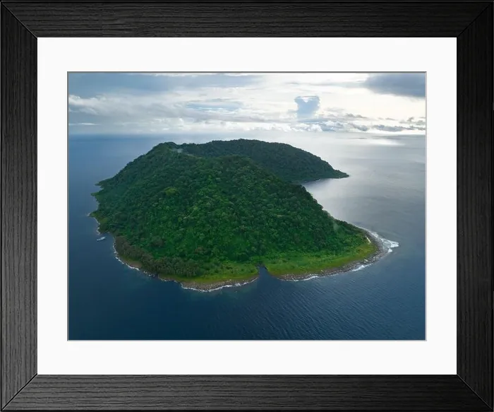 Framed Print : Rainforest covers the remote Mary Island which is fringed by a coral reef in the Solomon Islands. This country is home to amazing marine biodiversity Framed Print : Rainforest covers the remote Mary Island which is fringed by a coral reef in the Solomon Islands. This country is home to amazing marine biodiversity