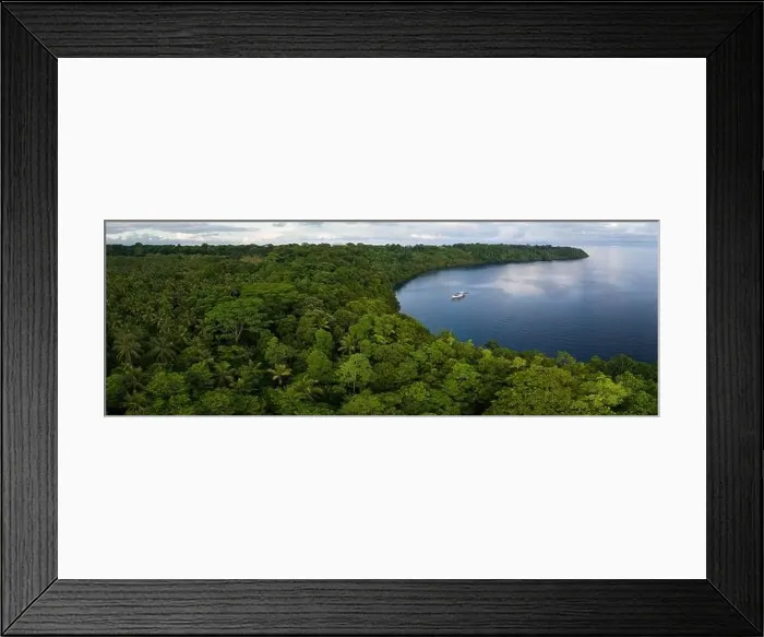 Framed Print : A lush, tropical island is fringed by a coral reef in the Solomon Islands. This beautiful country is home to spectacular marine biodiversity Framed Print : A lush, tropical island is fringed by a coral reef in the Solomon Islands. This beautiful country is home to spectacular marine biodiversity