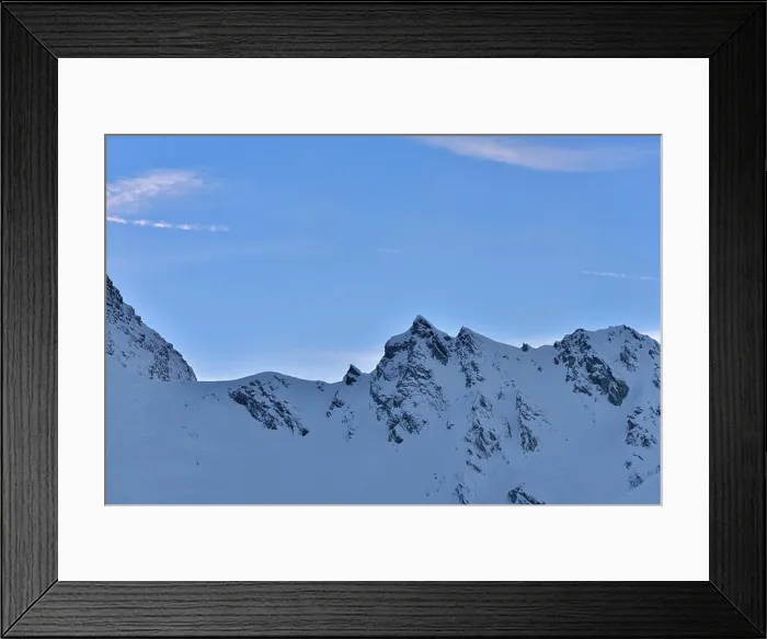 Framed Print : Beautiful view of mountain peak with sunset light on top against clear blue sky Framed Print : Beautiful view of mountain peak with sunset light on top against clear blue sky