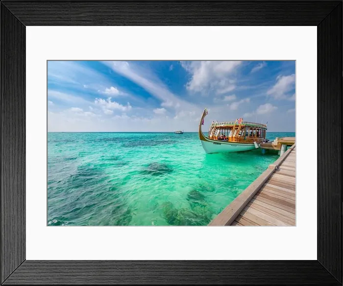 Framed Print : Maldives background with boat and tropical beach scene, blue sea and blue sky with colorful traditional Maldive boat Framed Print : Maldives background with boat and tropical beach scene, blue sea and blue sky with colorful traditional Maldive boat