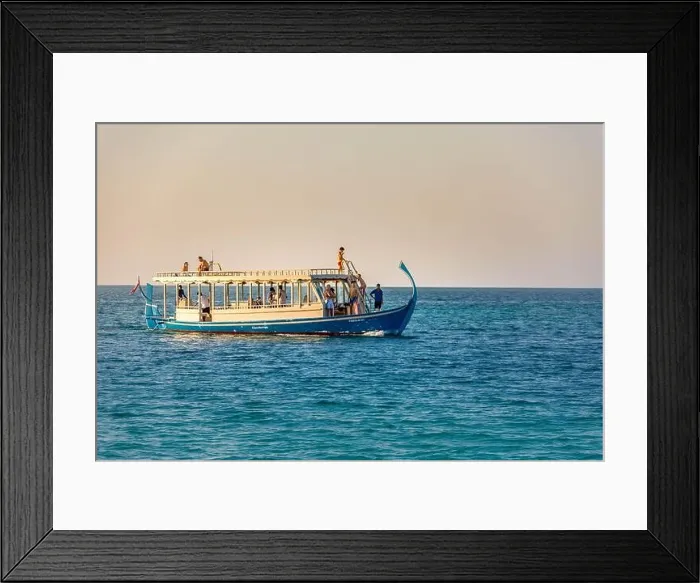 Framed Print : Maldives: Wonderful Maldivian boat Dhoni on tropical blue sea, taking tourist to a sunset cruise Framed Print : Maldives: Wonderful Maldivian boat Dhoni on tropical blue sea, taking tourist to a sunset cruise