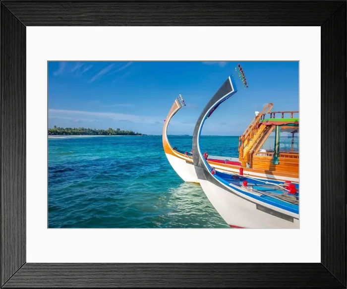 Framed Print : Maldives background with boat and tropical beach scene, blue sea and blue sky with colorful traditional Maldive boat Framed Print : Maldives background with boat and tropical beach scene, blue sea and blue sky with colorful traditional Maldive boat