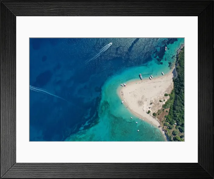 Framed Print : Aerial drone view of iconic small uninhabited island of Marathonisi featuring clear water, sandy shore and natural hatchery of Caretta-Caretta sea tur