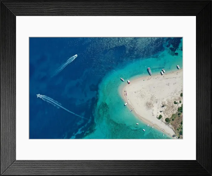 Framed Print : Aerial drone view of iconic small uninhabited island of Marathonisi featuring clear water, sandy shore and natural hatchery of Caretta-Caretta sea tur Framed Print : Aerial drone view of iconic small uninhabited island of Marathonisi featuring clear water, sandy shore and natural hatchery of Caretta-Caretta sea tur