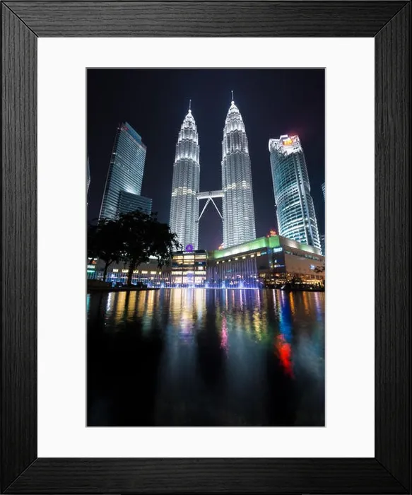 Framed Print : KUALA LUMPUR, MALAYSIA - April 16, 2016: Petronas Twin Towers with Musical fountain at night in Kuala Lumpur, Malaysia Framed Print : KUALA LUMPUR, MALAYSIA - April 16, 2016: Petronas Twin Towers with Musical fountain at night in Kuala Lumpur, Malaysia