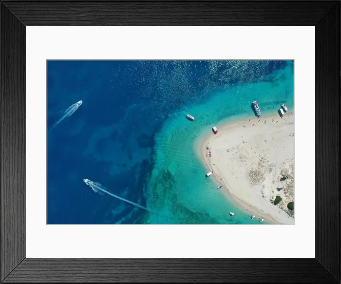 Framed Print : Aerial drone view of iconic small uninhabited island of Marathonisi featuring clear water, sandy shore and natural hatchery of Caretta-Caretta sea tur Framed Print : Aerial drone view of iconic small uninhabited island of Marathonisi featuring clear water, sandy shore and natural hatchery of Caretta-Caretta sea tur