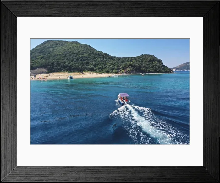 Framed Print : Small boat with tourists heading to iconic small uninhabited island of Marathonisi featuring clear water sandy shore and natural hatchery of Caretta-C Framed Print : Small boat with tourists heading to iconic small uninhabited island of Marathonisi featuring clear water sandy shore and natural hatchery of Caretta-C