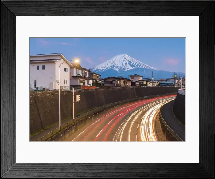 Framed Print : Mt. Fuji, Japan towering over neighborhoods and highways at twilight Framed Print : Mt. Fuji, Japan towering over neighborhoods and highways at twilight