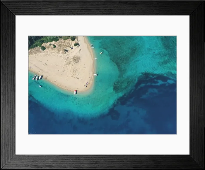 Framed Print : Aerial drone view of iconic small uninhabited island of Marathonisi featuring clear water sandy shore and natural hatchery of Caretta-Caretta sea turt