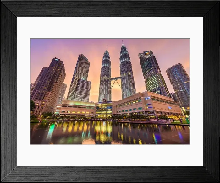 Framed Print : KUALA LUMPUR - SEPTEMBER 20, 2015: The Petronas Towers viewed from KLCC Park at twilight