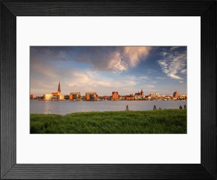 Framed Print : Rostock, Germany. Panoramic cityscape image of Rostock riverside with St. Peter's Church during summer sunset Framed Print : Rostock, Germany. Panoramic cityscape image of Rostock riverside with St. Peter's Church during summer sunset