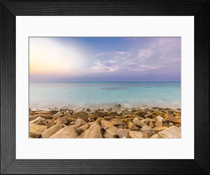 Framed Print : Tropical island view with beautiful sunset over the green boulders on a wave breaker. Rocks on exotic shore under colorful sky and horizon. Exotic sea Framed Print : Tropical island view with beautiful sunset over the green boulders on a wave breaker. Rocks on exotic shore under colorful sky and horizon. Exotic sea