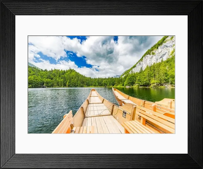 Framed Print : Beautiful view of traditional wooden rowing boat on scenic. Summer mountain lake pass scenic morning light at sunrise clouds over blue sky green trees