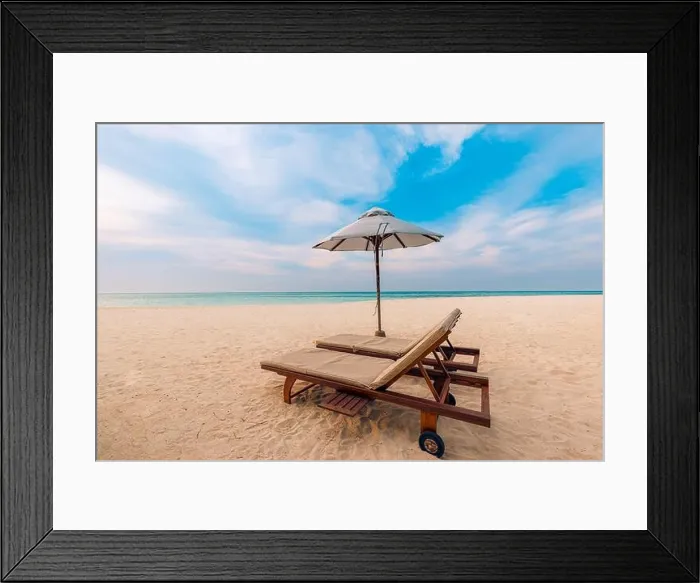 Framed Print : Beautiful tropical sunset scenery, two sun beds, loungers, umbrella. White sand, sea view with horizon, colorful twilight sky, calmness and relaxation Framed Print : Beautiful tropical sunset scenery, two sun beds, loungers, umbrella. White sand, sea view with horizon, colorful twilight sky, calmness and relaxation