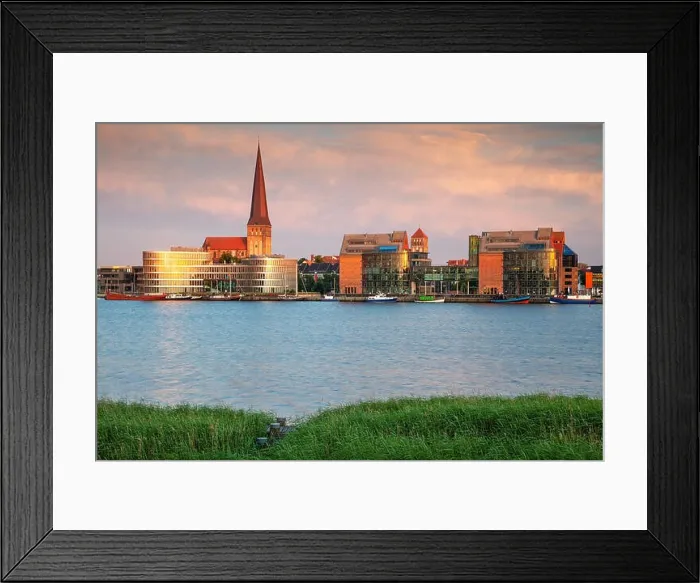 Framed Print : Rostock, Germany. Cityscape image of Rostock riverside with St. Peter's Church during summer sunset
