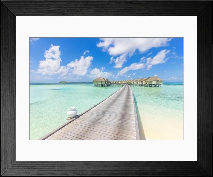 Framed Print : Panoramic travel landscape of Maldives beach. Tropical panorama, luxury water villa resort with wooden pier or jetty, blue sky. Luxury honeymoon Framed Print : Panoramic travel landscape of Maldives beach. Tropical panorama, luxury water villa resort with wooden pier or jetty, blue sky. Luxury honeymoon