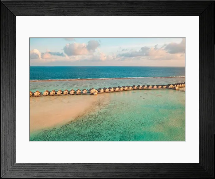Framed Print : Maldives sunset paradise. Tropical aerial landscape, seascape with long pier, water villas with amazing sea sandbank lagoon beach, tropical nature Framed Print : Maldives sunset paradise. Tropical aerial landscape, seascape with long pier, water villas with amazing sea sandbank lagoon beach, tropical nature