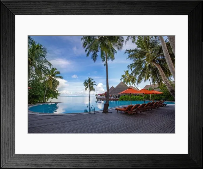 Framed Print : Beachside tourism landscape. Luxurious beach resort poolside, swimming pool and beach chairs or loungers, umbrellas tranquil tropical palm trees Framed Print : Beachside tourism landscape. Luxurious beach resort poolside, swimming pool and beach chairs or loungers, umbrellas tranquil tropical palm trees