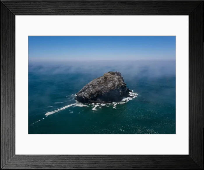 Framed Print : Seen from a bird's eye view, the cold, nutrient-rich waters of the Pacific Ocean wash against the scenic and rugged coastline of Northern California