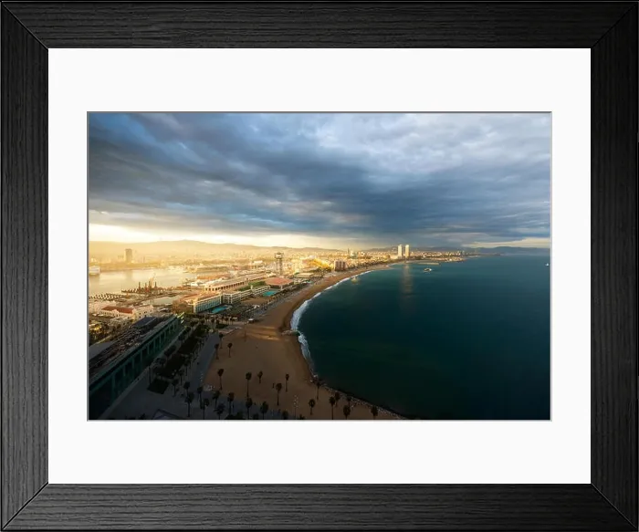 Framed Print : Aerial view of Barcelona Beach during sunset along seaside in Barcelona, Spain. Mediterranean Sea in Spain Framed Print : Aerial view of Barcelona Beach during sunset along seaside in Barcelona, Spain. Mediterranean Sea in Spain