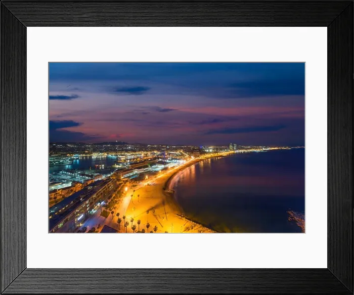 Framed Print : Aerial view of Barcelona Beach in summer night along seaside in Barcelona, Spain. Mediterranean Sea in Spain Framed Print : Aerial view of Barcelona Beach in summer night along seaside in Barcelona, Spain. Mediterranean Sea in Spain