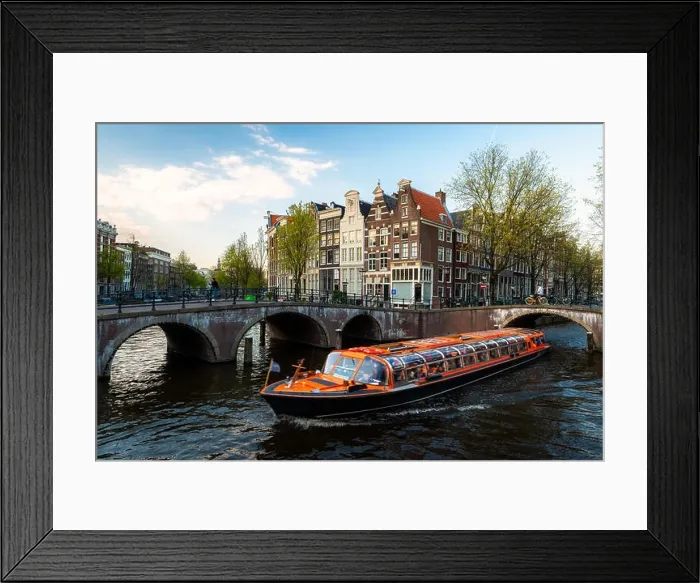 Framed Print : Amsterdam canal cruise ship with Netherlands traditional house in Amsterdam, Netherlands Framed Print : Amsterdam canal cruise ship with Netherlands traditional house in Amsterdam, Netherlands