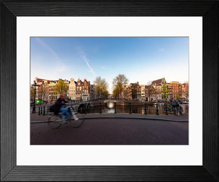 Framed Print : Amsterdam people riding bicycles in historical part in Amsterdam, Netherlands Framed Print : Amsterdam people riding bicycles in historical part in Amsterdam, Netherlands