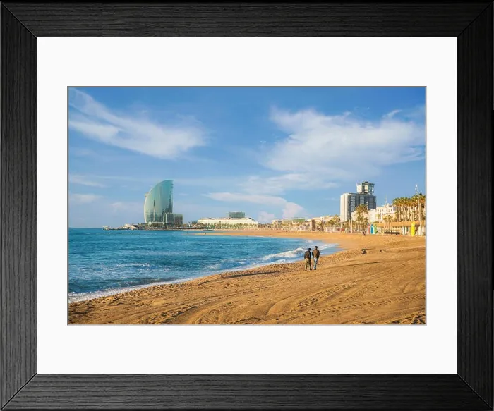 Framed Print : Pedestrians walk along Barceloneta Beach in Barcelona with colorful sky at sunrise. Seafront, beach, coast in Spain. Suburb of Barcelona, Catalonia Framed Print : Pedestrians walk along Barceloneta Beach in Barcelona with colorful sky at sunrise. Seafront, beach, coast in Spain. Suburb of Barcelona, Catalonia