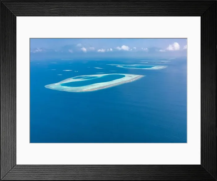 Framed Print : Aerial view of Maldives atolls is the world top beauty. Maldives tourism. Aerial seascape and landscape with shades of view, exotic travel destination Framed Print : Aerial view of Maldives atolls is the world top beauty. Maldives tourism. Aerial seascape and landscape with shades of view, exotic travel destination