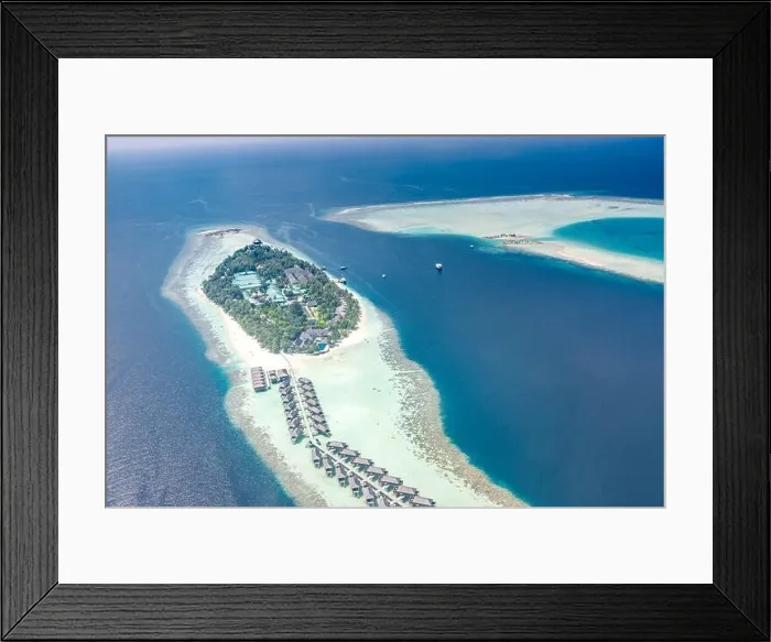 Framed Print : Tropical island at Maldives. Luxury resort from aerial view, over water villas and bungalows over amazing blue sea and lagoon. Luxury summer vacation Framed Print : Tropical island at Maldives. Luxury resort from aerial view, over water villas and bungalows over amazing blue sea and lagoon. Luxury summer vacation