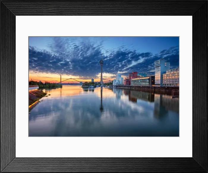 Framed Print : Düsseldorf, Germany. Cityscape image of Düsseldorf, Germany with the Media Harbour and reflection of the city in the Rhine river, during sunrise Framed Print : Düsseldorf, Germany. Cityscape image of Düsseldorf, Germany with the Media Harbour and reflection of the city in the Rhine river, during sunrise