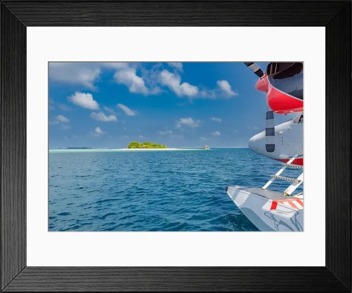 Framed Print : Seaplane at tropical beach resort. Maldives air travel and tourism blue sea with tropical island. Summer holiday vacation background, luxury travel Framed Print : Seaplane at tropical beach resort. Maldives air travel and tourism blue sea with tropical island. Summer holiday vacation background, luxury travel