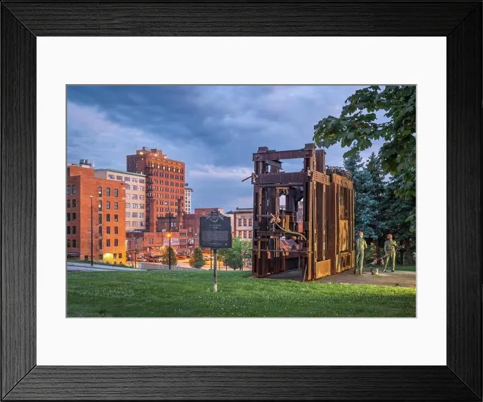 Framed Print : YOUNGSTOWN, OHIO - AUGUST 7, 2019: Downtown Youngstown with the Little Steel Strike of 1937 monument and memorial at twilight Framed Print : YOUNGSTOWN, OHIO - AUGUST 7, 2019: Downtown Youngstown with the Little Steel Strike of 1937 monument and memorial at twilight
