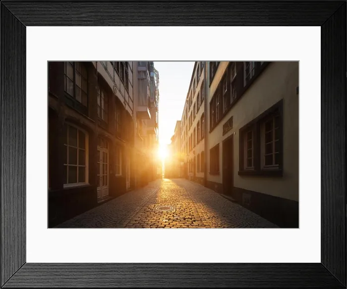 Framed Print : View of old town with stone street in Europe in beautiful evening light at sunset Framed Print : View of old town with stone street in Europe in beautiful evening light at sunset