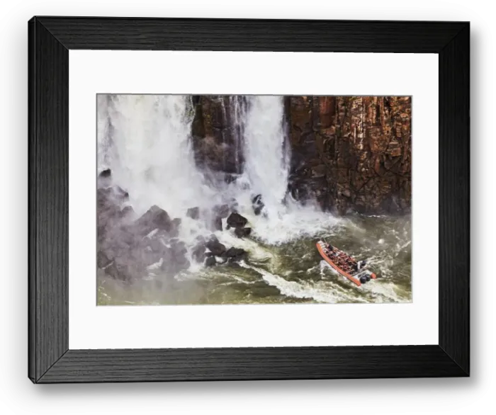 Framed Print : Popular tourist adventure activity at Iguazu Falls, speedboat approaches to water stream, view from Brazilian side Framed Print : Popular tourist adventure activity at Iguazu Falls, speedboat approaches to water stream, view from Brazilian side